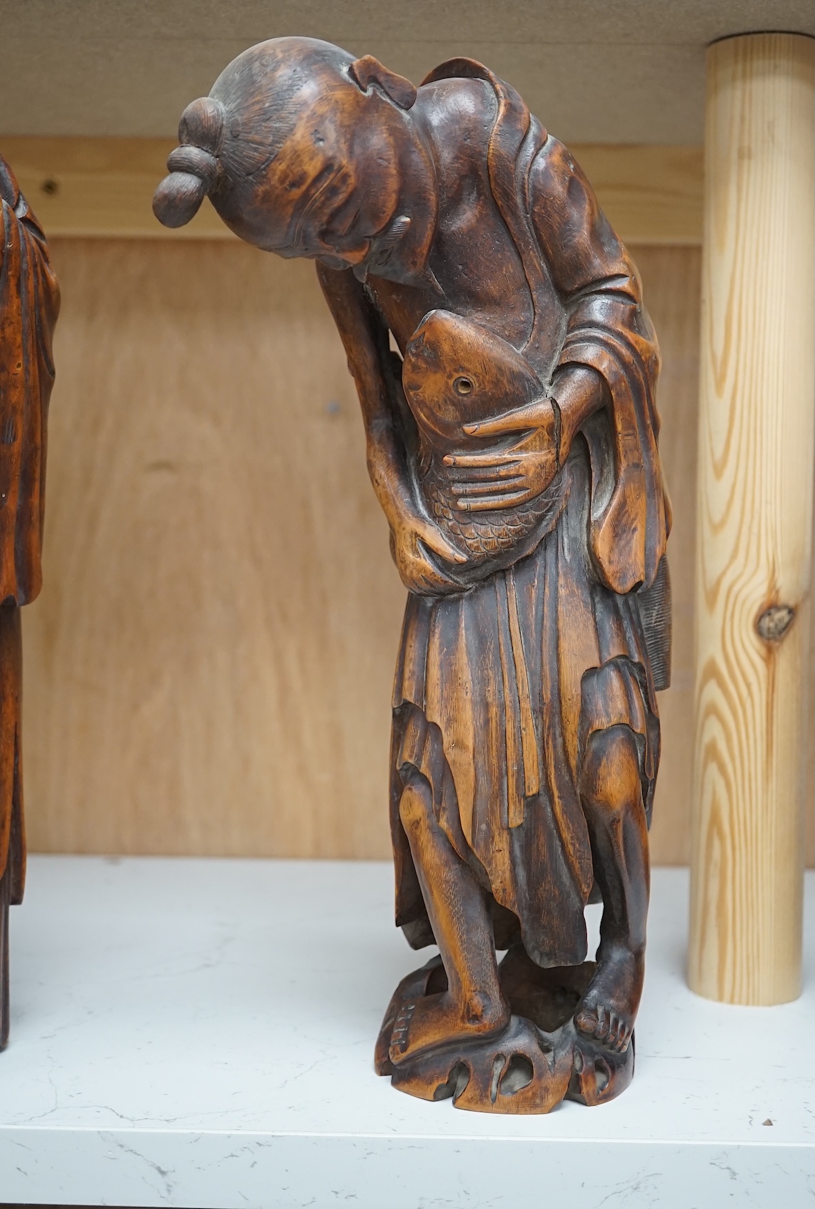 Two 19th century Chinese bamboo root figures of a fisherman and Shou Lao, tallest 32cm. Condition - fair to good